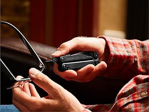 Photo of person fixing glasses with the Wave+ multi-tool