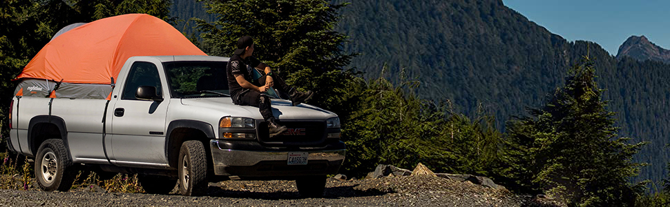 Rightline Gear Truck Tent on a white GMC; man sitting on hood of truck