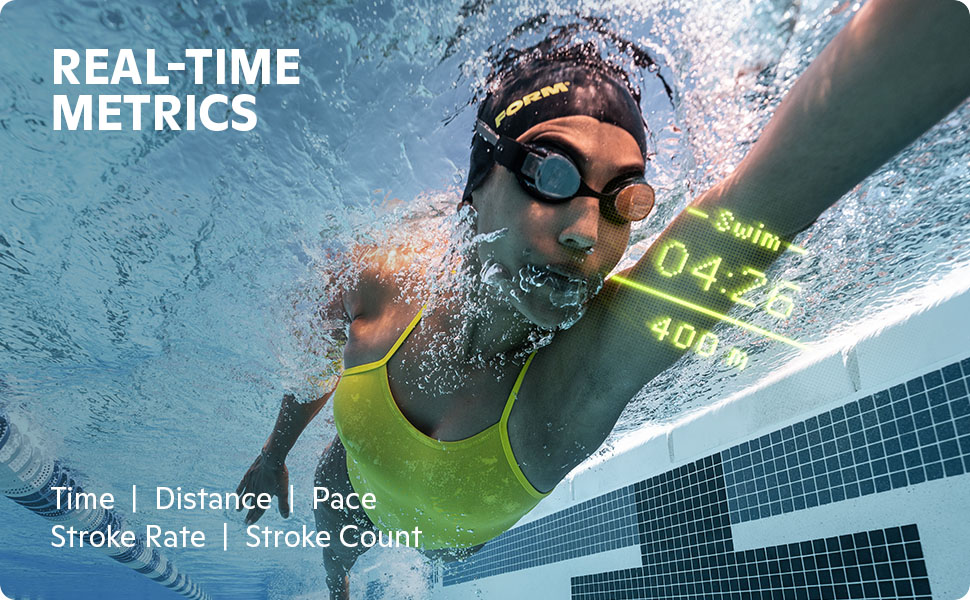 Swimmer wearing FORM goggles in a pool to see swim time and distance metrics projected