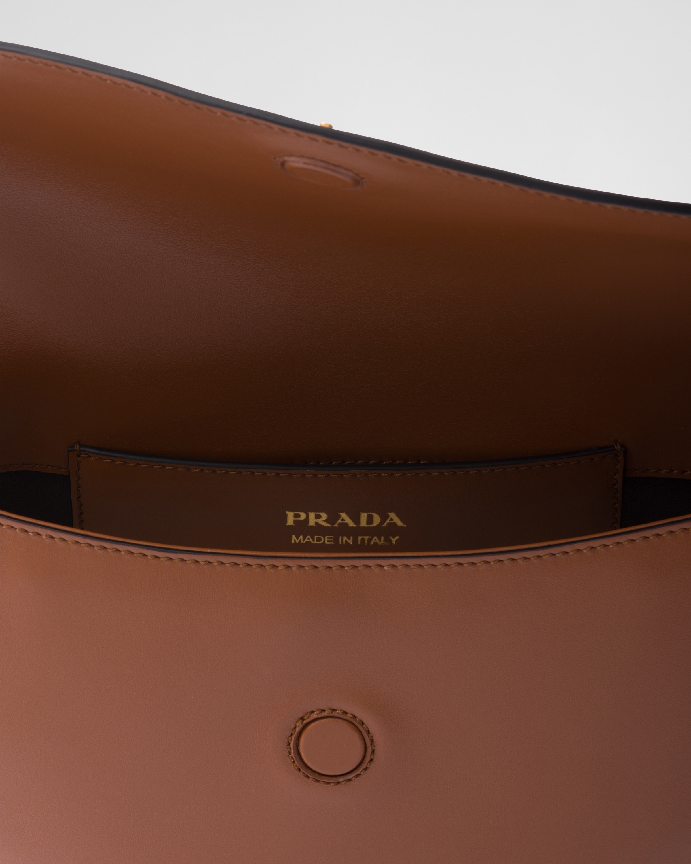 Prada Arqué leather shoulder bag with flap