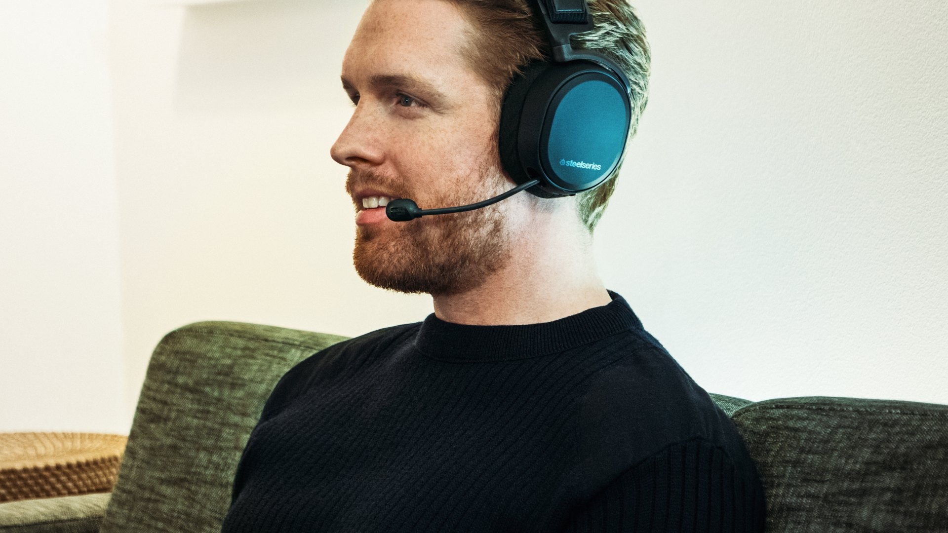 A man wearing the SteelSeries Arctis Pro headset looking to the left