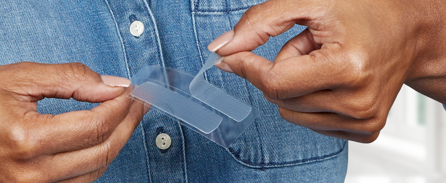 Up-close image of woman peeling Crest 3DWhitestrip away from backing liner.